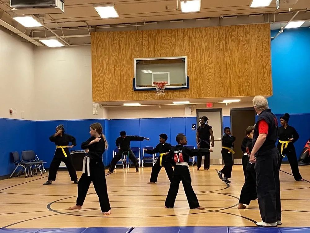 Young people practicing martial arts in a gym